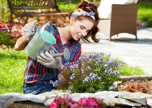 Gardener sorting green waste at Turnham Green property